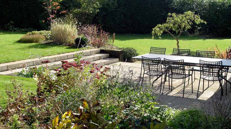 Terracing a sloping site with stone steps and sleeper walls